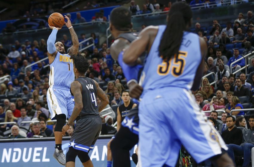 Dec 10, 2016; Orlando, FL, USA; Denver Nuggets guard Jameer Nelson (1) shoots a fall away jumper over Orlando Magic guard Elfrid Payton (4) during the second half of an NBA basketball game at Amway Center. The Nuggets won 121-113. Mandatory Credit: Reinhold Matay-USA TODAY Sports