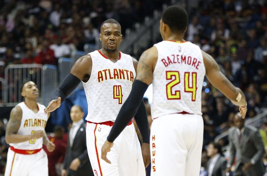 Apr 1, 2016; Atlanta, GA, USA; Atlanta Hawks forward Paul Millsap (4) high fives forward Kent Bazemore (24) against the Cleveland Cavaliers in the fourth quarter at Philips Arena. The Cavaliers defeated the Hawks 110-108 in overtime. Mandatory Credit: Brett Davis-USA TODAY Sports