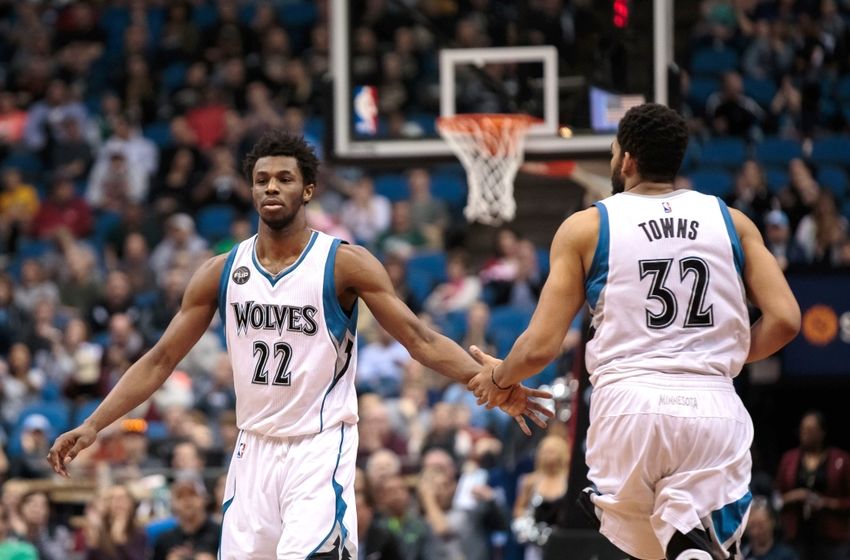 Apr 3, 2016; Minneapolis, MN, USA; Minnesota Timberwolves forward Andrew Wiggins (22) high fives center Karl-Anthony Towns (32) in the third quarter against the Dallas Mavericks at Target Center. The Dallas Mavericks beat the Minnesota Timberwolves 88-78. Mandatory Credit: Brad Rempel-USA TODAY Sports
