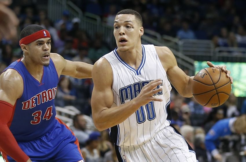 Apr 6, 2016; Orlando, FL, USA; Orlando Magic forward Aaron Gordon (00) drives around Detroit Pistons forward Tobias Harris (34) during the second half of a basketball game at Amway Center. The Pistons won 108-104. Mandatory Credit: Reinhold Matay-USA TODAY Sports
