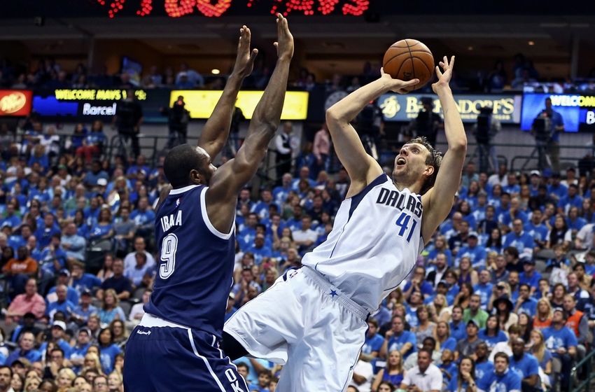 Apr 23, 2016; Dallas, TX, USA; Dallas Mavericks forward Dirk Nowitzki (41) shoots as Oklahoma City Thunder forward Serge Ibaka (9) defends during the second quarter in game four of the first round of the NBA Playoffs at American Airlines Center. Mandatory Credit: Kevin Jairaj-USA TODAY Sports