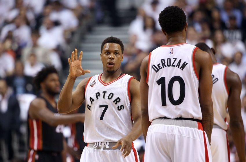 May 11, 2016; Toronto, Ontario, CAN; Toronto Raptors point guard Kyle Lowry (7) talks to guard DeMar DeRozan (10) against the Miami Heat in game five of the second round of the NBA Playoffs at Air Canada Centre. The Raptors beat the Heat 99-91. Mandatory Credit: Tom Szczerbowski-USA TODAY Sports