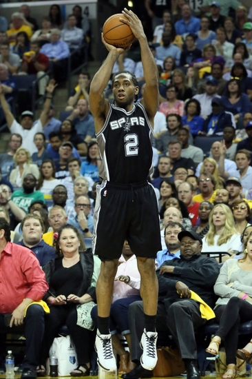 Apr 22, 2016; Memphis, TN, USA; San Antonio Spurs forward Kawhi Leonard (2) shoots a three point shot against the Memphis Grizzlies in game three of the first round of the NBA Playoffs at FedExForum. Spurs defeated Grizzlies 96-87. Mandatory Credit: Nelson Chenault-USA TODAY Sports