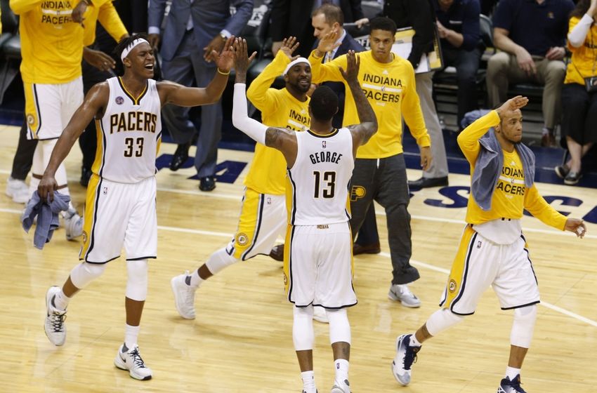 Apr 29, 2016; Indianapolis, IN, USA; Indiana Pacers forward Paul George (13) celebrates with center Myles Turner (33) and guard Ty Lawson (10) against the Toronto Raptors during the second half in game six of the first round of the 2016 NBA Playoffs at Bankers Life Fieldhouse. The Pacers won 101-83. Mandatory Credit: Brian Spurlock-USA TODAY Sports