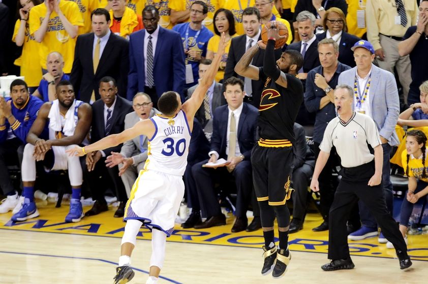 Jun 19, 2016; Oakland, CA, USA; Cleveland Cavaliers guard Kyrie Irving (2) shoots the the game winning shot during the fourth quarter against Golden State Warriors guard Stephen Curry (30) in game seven of the NBA Finals at Oracle Arena. Mandatory Credit: Kelley L Cox-USA TODAY Sports