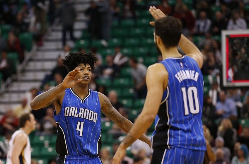 Dec 3, 2015; Salt Lake City, UT, USA; Orlando Magic guard Elfrid Payton (4) and forward Evan Fournier (10) celebrate after beating the Utah Jazz 103-94 at Vivint Smart Home Arena. Mandatory Credit: Jeff Swinger-USA TODAY Sports