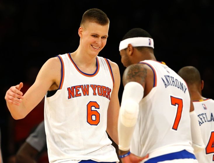 Dec 19, 2015; New York, NY, USA; New York Knicks forward Kristaps Porzingis (6) and New York Knicks forward Carmelo Anthony (7) react after a shot by Porzingis (6) during second half against the Chicago Bulls at Madison Square Garden. The New York Knicks defeated the Chicago Bulls 107-91. Mandatory Credit: Noah K. Murray-USA TODAY Sports