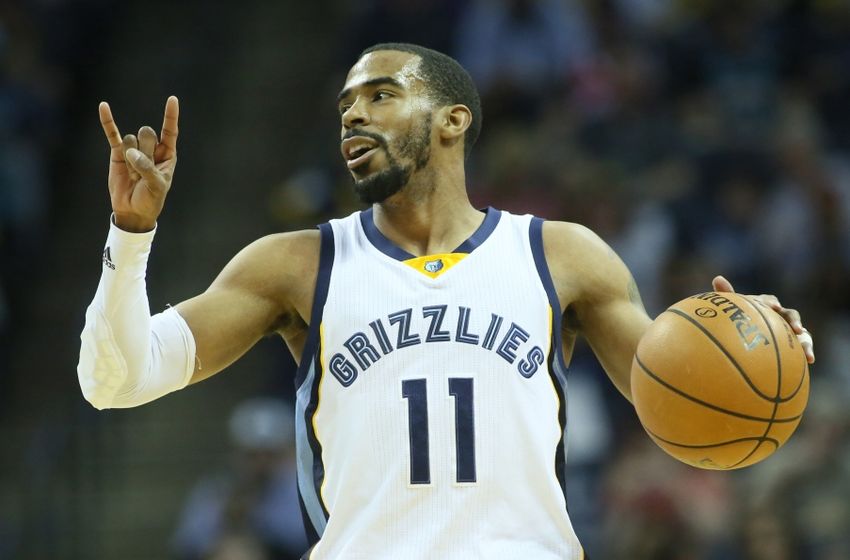 Mar 6, 2016; Memphis, TN, USA; Memphis Grizzlies guard Mike Conley (11) signals to his team as he dribbles in the first quarter against the Phoenix Suns at FedExForum. Mandatory Credit: Nelson Chenault-USA TODAY Sports