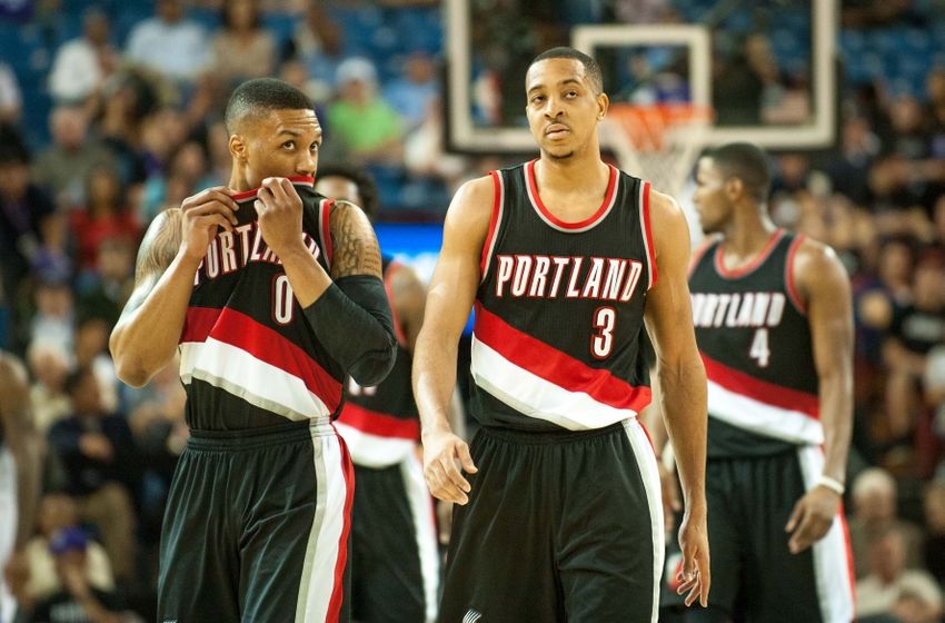 Apr 5, 2016; Sacramento, CA, USA; Portland Trail Blazers guard Damian Lillard (0) and guard C.J. McCollum (3) walk up the court during the fourth quarter of the game against the Sacramento Kings at Sleep Train Arena. The Portland Trail Blazers defeated the Sacramento Kings 115-107. Mandatory Credit: Ed Szczepanski-USA TODAY Sports
