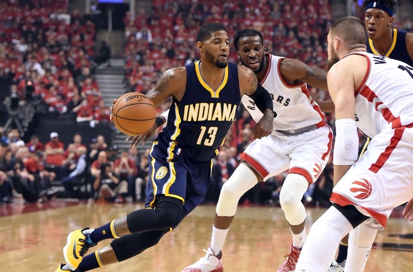 May 1, 2016; Toronto, Ontario, CAN; Indiana Pacers forward Paul George (13) dribbles past Toronto Raptors forward DeMarre Carroll (5) in game seven of the first round of the 2016 NBA Playoffs at Air Canada Centre. Mandatory Credit: Dan Hamilton-USA TODAY Sports
