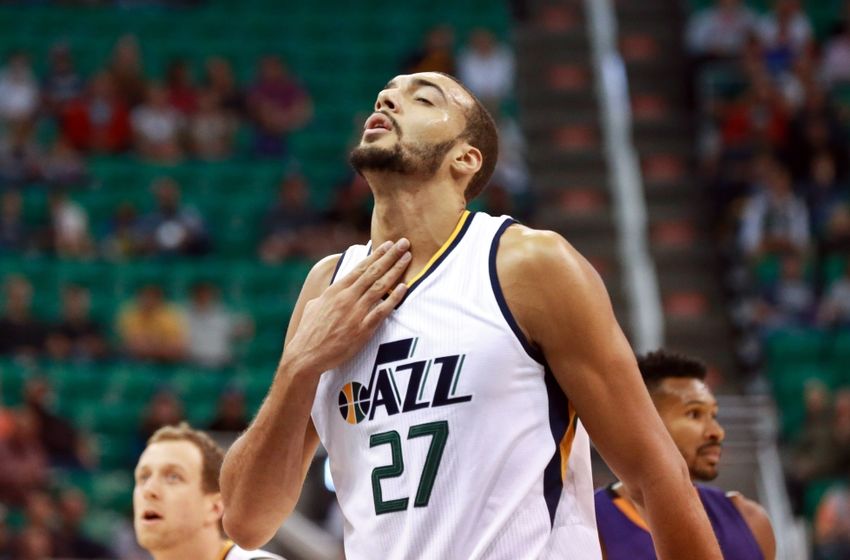 Oct 12, 2016; Salt Lake City, UT, USA; Utah Jazz center Rudy Gobert (27) rubs his throat after he gets hit in the neck during the first quarter against the Phoenix Suns at Vivint Smart Home Arena. Mandatory Credit: Chris Nicoll-USA TODAY Sports