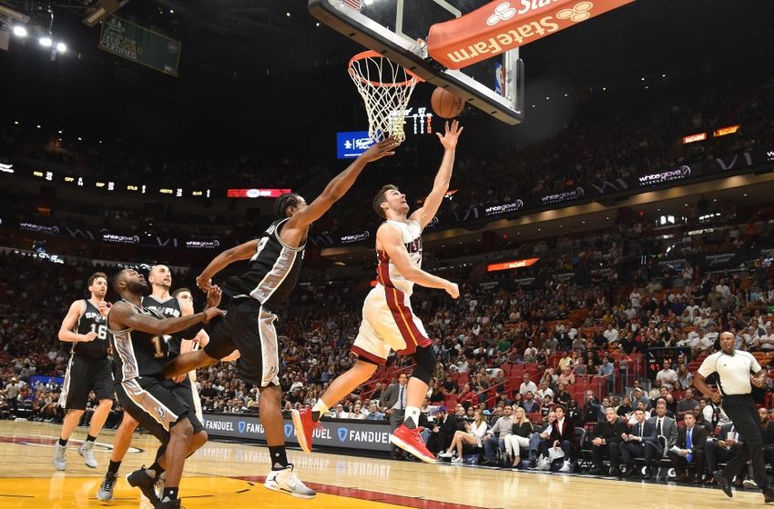 Oct 30, 2016; Miami, FL, USA; Miami Heat guard Goran Dragic (7) scores a basket past San Antonio Spurs forward Kawhi Leonard (2) during the second half at American Airlines Arena. The Spurs won 106-99. Mandatory Credit: Steve Mitchell-USA TODAY Sports