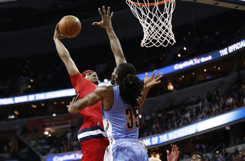 Jan 28, 2016; Washington, DC, USA; Denver Nuggets forward Kenneth Faried (35) blocks a dunk attempt by Washington Wizards guard Bradley Beal (3) in the fourth quarter at Verizon Center. The Nuggets won 117-113. Mandatory Credit: Geoff Burke-USA TODAY Sports
