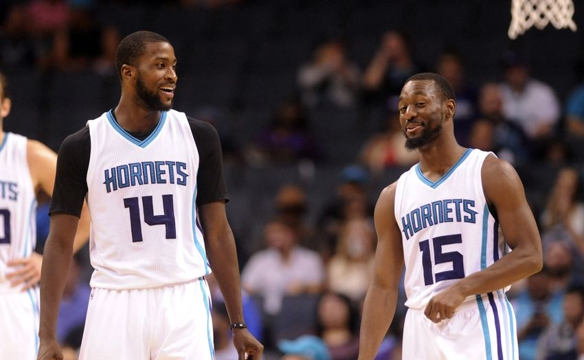 Oct 20, 2016; Charlotte, NC, USA; Charlotte Hornets forward Michael Kidd-Gilchrist (14) talks with guard Kemba Walker (15) during the second half of the game against the Miami Heat at the Spectrum Center. Hornets win 96-88. Mandatory Credit: Sam Sharpe-USA TODAY Sports