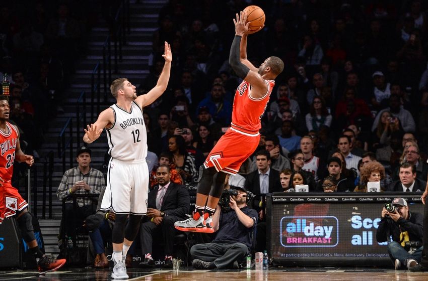 Oct 31, 2016; Brooklyn, NY, USA; Chicago Bulls guard Dwyane Wade (3) shoots the ball as Brooklyn Nets guard Joe Harris (12) defends during the third quarter at Barclays Center. Mandatory Credit: Dennis Schneidler-USA TODAY Sports