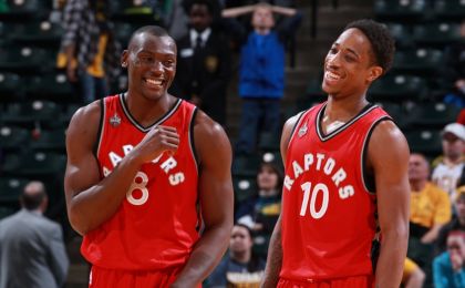 Mar 17, 2016; Indianapolis, IN, USA; Toronto Raptors forward Bismack Biyombo (8) and DeMar DeRozan (10) smile as the Raptors take a commanding lead in overtime against the Indiana Pacers at Bankers Life Fieldhouse. Toronto defeats Indiana 101-94 in overtime. Mandatory Credit: Brian Spurlock-USA TODAY Sports
