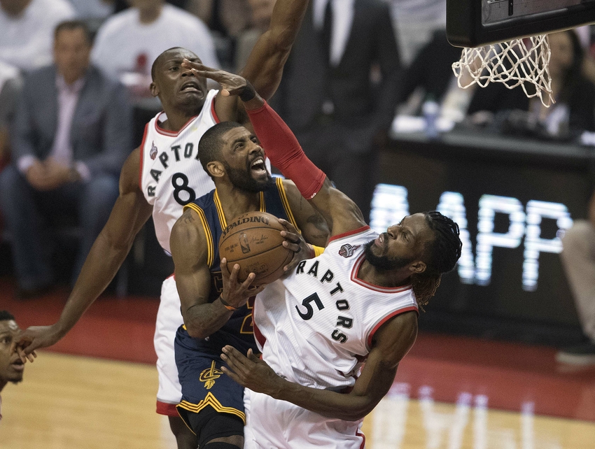 May 27, 2016; Toronto, Ontario, CAN; Cleveland Cavaliers guard Kyrie Irving (2) drives to the basket as Toronto Raptors forward DeMarre Carroll (5) tries to defend during the first quarter of game six of the Eastern conference finals of the NBA Playoffs at Air Canada Centre. Mandatory Credit: Nick Turchiaro-USA TODAY Sports