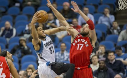 Feb 10, 2016; Minneapolis, MN, USA; Minnesota Timberwolves center Karl-Anthony Towns (32) drives to the basket against Toronto Raptors center Jonas Valanciunas (17) in the first half at Target Center. Mandatory Credit: Jesse Johnson-USA TODAY Sports