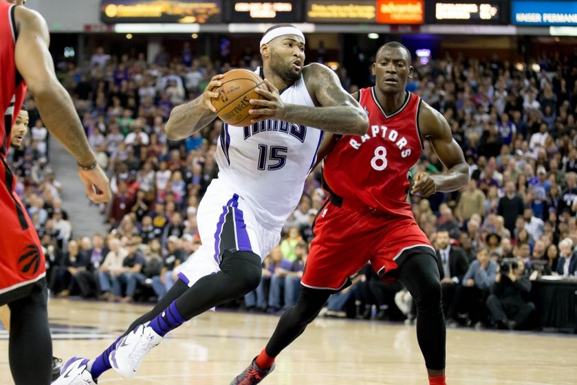 Nov 15, 2015; Sacramento, CA, USA; Sacramento Kings forward DeMarcus Cousins (15) moves in against Toronto Raptors forward Bismack Biyombo (8) during the fourth quarter at Sleep Train Arena. The Sacramento Kings defeated the Toronto Raptors 107-101. Mandatory Credit: Kelley L Cox-USA TODAY Sports