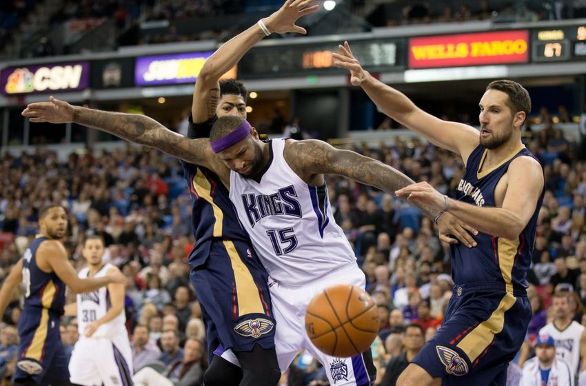 Jan 13, 2016; Sacramento, CA, USA; Sacramento Kings center DeMarcus Cousins (15) loses the ball between New Orleans Pelicans forward Anthony Davis (23) and forward Ryan Anderson (33) during the fourth quarter at Sleep Train Arena. New Orleans defeated Sacramento 109-97. Mandatory Credit: Kelley L Cox-USA TODAY Sports