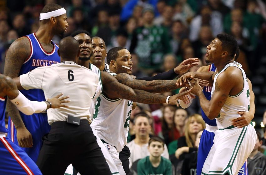Dec 31, 2014; Boston, MA, USA; Referee Tony Brown (6) and Boston Celtics guard Jameer Nelson (28) try to separate Sacramento Kings center DeMarcus Cousins (15) and Boston Celtics guard Marcus Smart (right) during the second half of the Boston Celtics 106-84 win over the Sacramento Kings at TD Garden. Both players received a technical foul on the play. Mandatory Credit: Winslow Townson-USA TODAY Sports