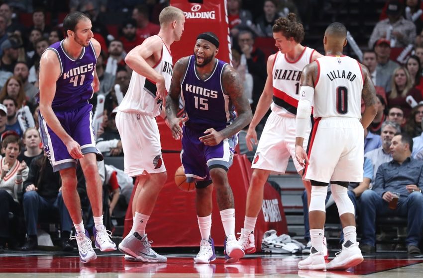 Nov 11, 2016; Portland, OR, USA; Sacramento Kings center DeMarcus Cousins (15) reacts after scoring a basket over Portland Trail Blazers forward Meyers Leonard (11) in the second half at Moda Center at the Rose Quarter. Mandatory Credit: Jaime Valdez-USA TODAY Sports
