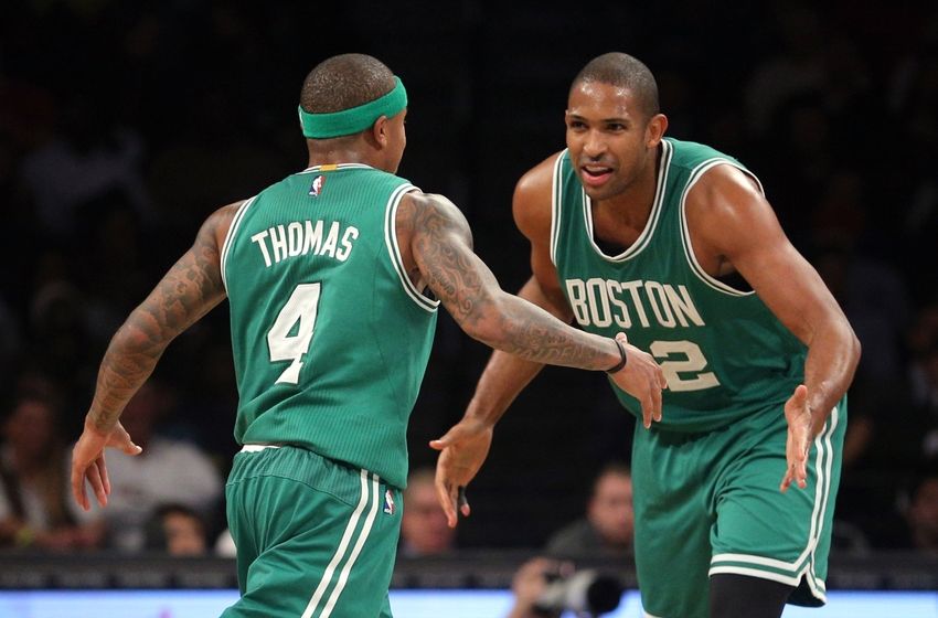 Nov 23, 2016; Brooklyn, NY, USA; Boston Celtics point guard Isaiah Thomas (4) celebrates with Boston Celtics center Al Horford (42) during the third quarter at Barclays Center. Mandatory Credit: Brad Penner-USA TODAY Sports