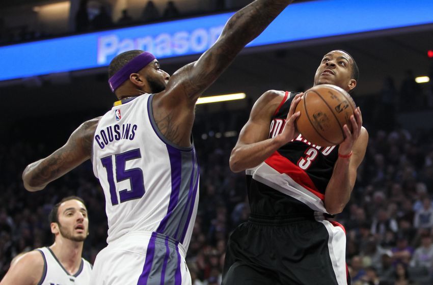 Dec 20, 2016; Sacramento, CA, USA; Portland Trail Blazers guard C.J. McCollum (3) shoots the ball against Sacramento Kings forward DeMarcus Cousins (15) during the first quarter at Golden 1 Center. The Trail Blazers defeated the Kings 126-121. Mandatory Credit: Sergio Estrada-USA TODAY Sports