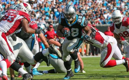 Oct 30, 2016; Charlotte, NC, USA; Carolina Panthers running back Jonathan Stewart (28) runs towards the goal line as Arizona Cardinals defensive end Calais Campbell (93) defends during the second half at Bank of America Stadium. Carolina won 30-20. Mandatory Credit: Jim Dedmon-USA TODAY Sports