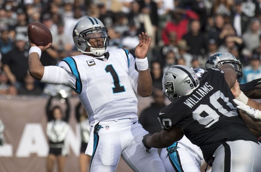 November 27, 2016; Oakland, CA, USA; Carolina Panthers quarterback Cam Newton (1) passes the football against Oakland Raiders defensive tackle Dan Williams (90) during the first quarter at Oakland Coliseum. Mandatory Credit: Kyle Terada-USA TODAY Sports