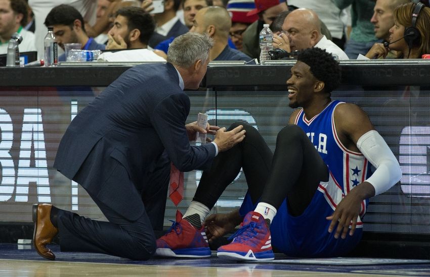 Oct 26, 2016; Philadelphia, PA, USA; Philadelphia 76ers center Joel Embiid (21) talks with head coach Brett Brown before entering the game against the Oklahoma City Thunder in the second half at Wells Fargo Center. The Oklahoma City Thunder won 103-97. Mandatory Credit: Bill Streicher-USA TODAY Sports