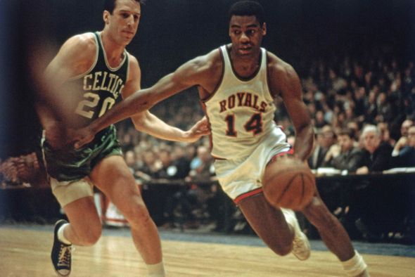 CINCINNATI - 1970: Oscar Robertson #14 of the Cincinnati Royals drives against the Boston Celtics during the NBA game in Cincinnati, Ohio. Mandatory Copyright Notice: Copyright 1970 NBAE (Photo by Walter Iooss/NBAE via Getty Images)