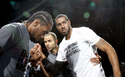 SAN ANTONIO,TX - FEBRUARY 3: Kawhi Leonard #2 of the San Antonio Spurs,Tony Parker #9 of the San Antonio Spurs and LaMarcus Aldridge #12 of the San Antonio Spurs huddle before their game against the New Orleans Pelicans at AT&T Center on February 3, 2016 in San Antonio, Texas. NOTE TO USER: User expressly acknowledges and agrees that , by downloading and or using this photograph, User is consenting to the terms and conditions of the Getty Images License Agreement. (Photo by Ronald Cortes/Getty Images)