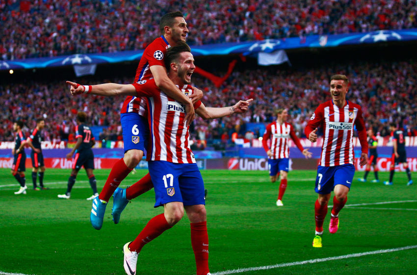 MADRID, SPAIN - APRIL 27: Saul Niguez of Atletico Madrid (17) celebrates with Koke of Atletico Madrid and team mates as he scores their first goal during the UEFA Champions League semi final first leg match between Club Atletico de Madrid and FC Bayern Muenchen at Vincente Calderon on April 27, 2016 in Madrid, Spain. (Photo by Gonzalo Arroyo Moreno/Getty Images)