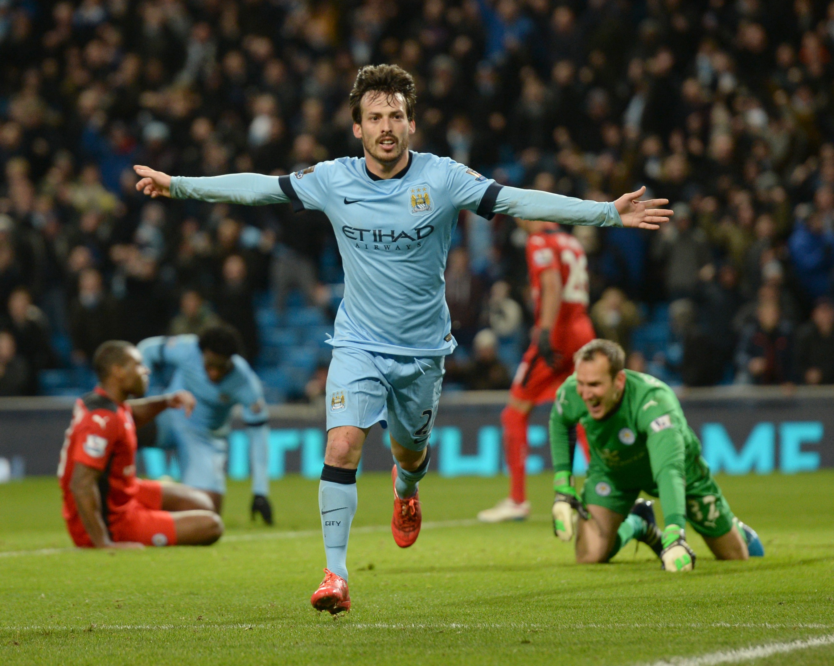 MANCHESTER, ENGLAND - MARCH 04 : Manchester City's David Silva scores his teams first goal and celebrates during the Premier League match between Manchester City and Leicester City at The Etihad Stadium, Manchester, England on 4th March 2015. (Photo by Howard Walker/Anadolu Agency/Getty Images)