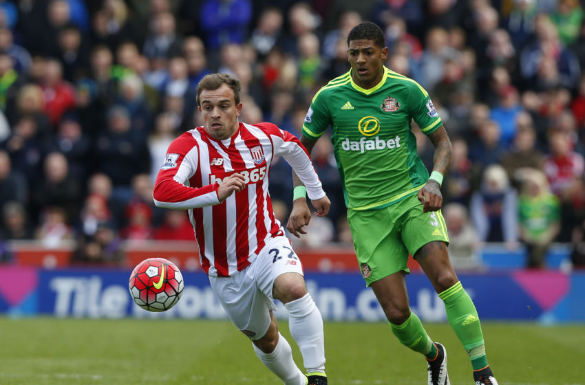Stoke City's Swiss midfielder Xherdan Shaqiri (L) runs ahead of Sunderland's Dutch defender Patrick van Aanholt (R) during the English Premier League football match between Stoke City and Sunderland at the Britannia Stadium in Stoke-on-Trent, central England on April 30, 2016. / AFP / LINDSEY PARNABY / RESTRICTED TO EDITORIAL USE. No use with unauthorized audio, video, data, fixture lists, club/league logos or 'live' services. Online in-match use limited to 75 images, no video emulation. No use in betting, games or single club/league/player publications. / (Photo credit should read LINDSEY PARNABY/AFP/Getty Images)