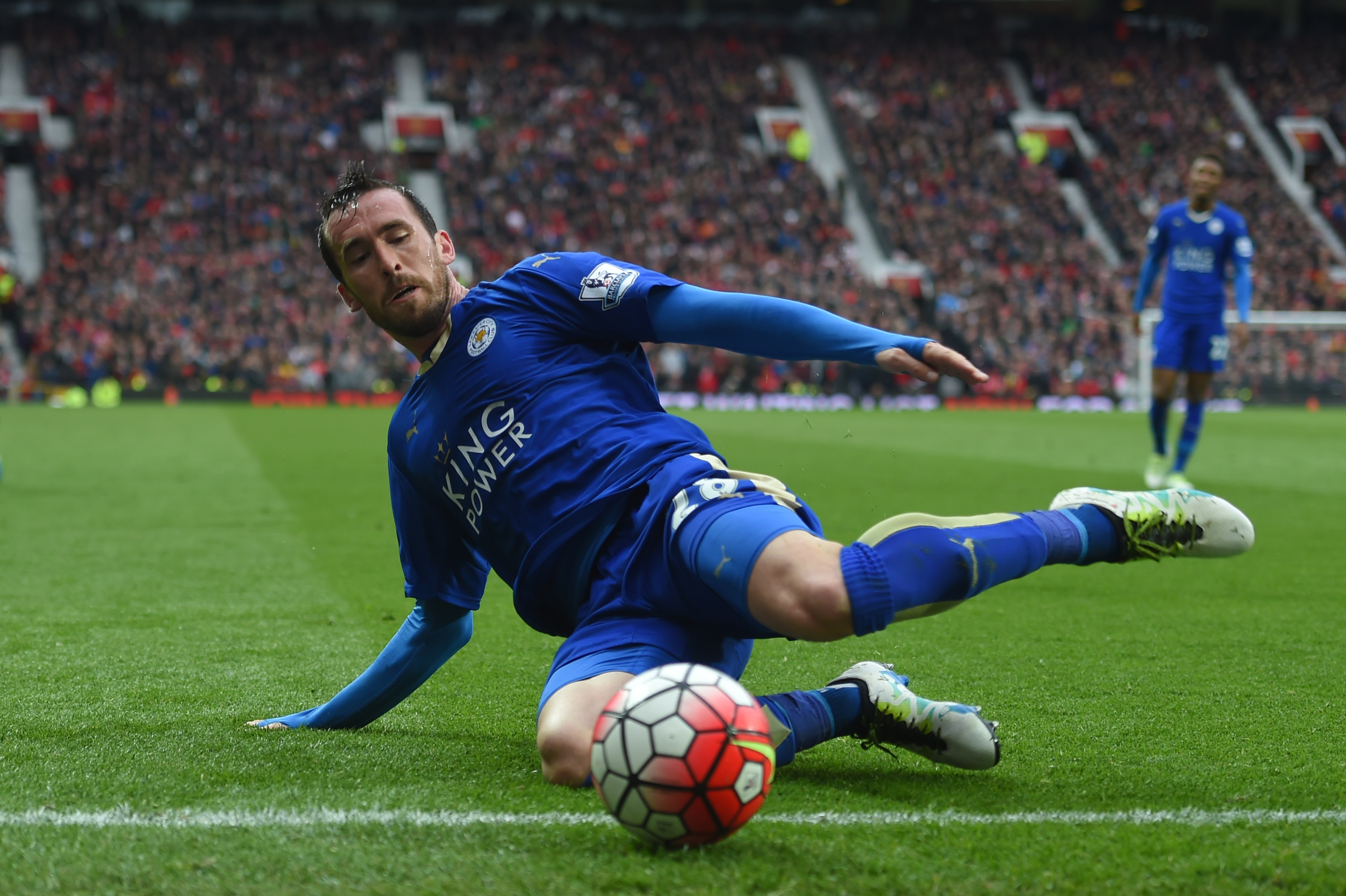 MANCHESTER, ENGLAND - MAY 01: Christian Fuchs of Leicester City slides for the ball during the Barclays Premier League match between Manchester United and Leicester City at Old Trafford on May 1, 2016 in Manchester, England. (Photo by Michael Regan/Getty Images)