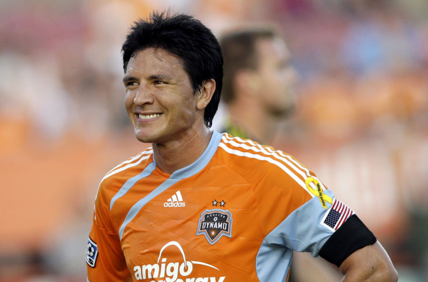 HOUSTON - JULY 10: Forward Brian Ching #25 of the Houston Dynamo smiles after missing a goal at close range on a put back in the second half against the Columbus Crew at Robertson Stadium at on July 10, 2010 in Houston, Texas. (Photo by Bob Levey/Getty Images)