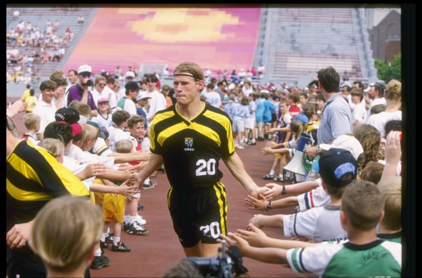 19 May 1996: Brian McBride of the Columbus Crew high fives the fan as he walks off the field after a game against the Colorado Rapids at Ohio Stadium in Columbus, Ohio. The Rapids won the game 4-2. Mandatory Credit: Rick Stewart /Allsport