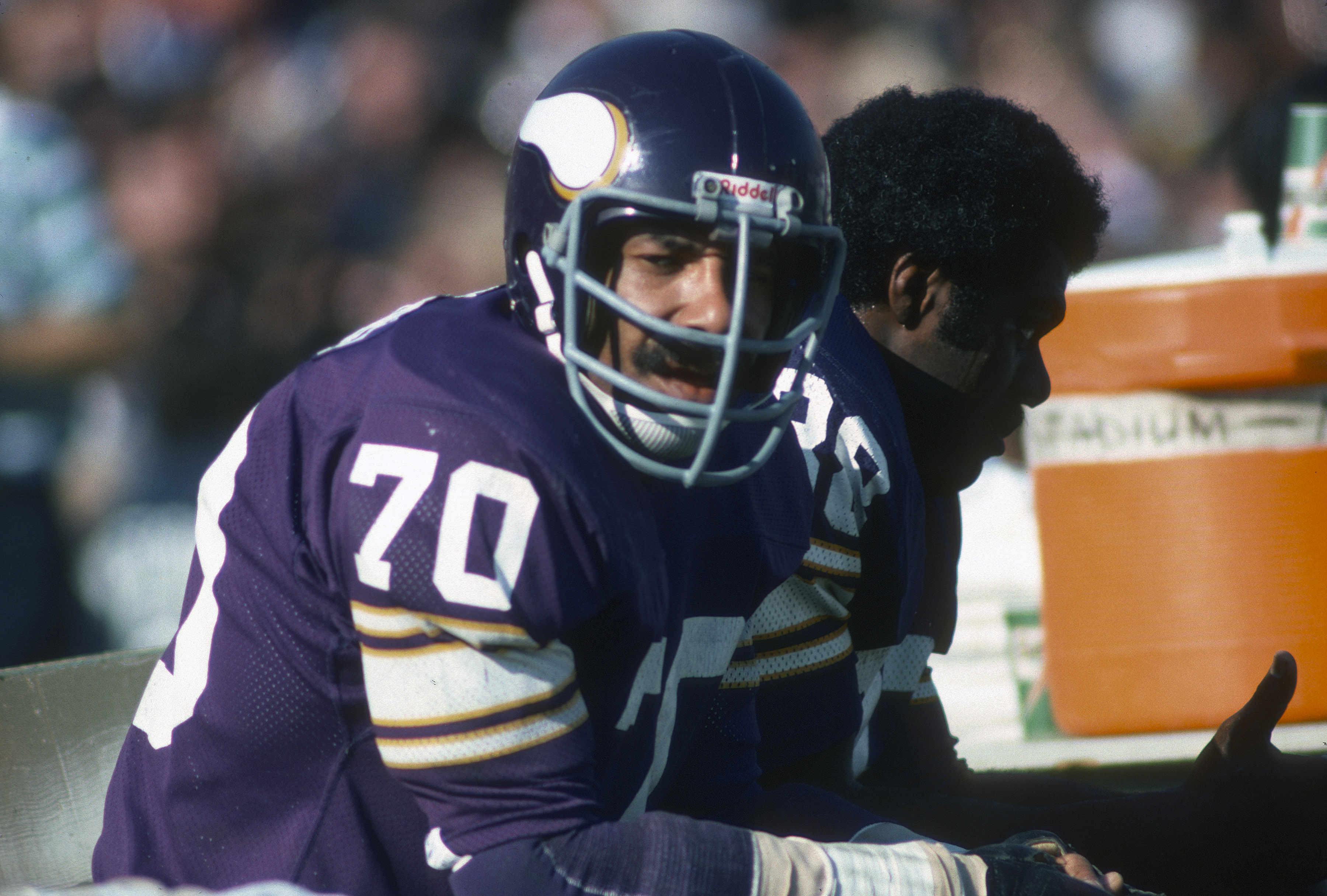 PASADENA, CA- JANUARY 9: Jim Marshall #70 of the Minnesota Vikings looks on from the bench against the Oakland Raiders during Super Bowl XI on January 9, 1977 at the Rose Bowl in Pasadena, California. The Raiders won the Super Bowl 32 -14. (Photo by Focus on Sport/Getty Images)
