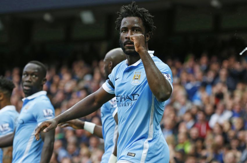 Manchester City's Ivorian striker Wilfried Bony (L) celebrates scoring their second goal during the English Premier League football match between Manchester City and Bournemouth at the Etihad Stadium in Manchester, northwest England, on October 17, 2015. AFP PHOTO / LINDSEY PARNABY RESTRICTED TO EDITORIAL USE. No use with unauthorized audio, video, data, fixture lists, club/league logos or 'live' services. Online in-match use limited to 75 images, no video emulation. No use in betting, games or single club/league/player publications (Photo credit should read LINDSEY PARNABY/AFP/Getty Images)
