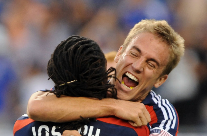FOXBOROUGH, MA - JUNE 7: Taylor Twellman #20 of the New England Revolution celebrates his 100th career goal with Shalrie Joseph #21 during match against the New York Red Bulls June 7, 2009 at Gillette Stadium in Foxborough, Massachusetts. (Photo by Keith Nordstrom/MLS via Getty Images)