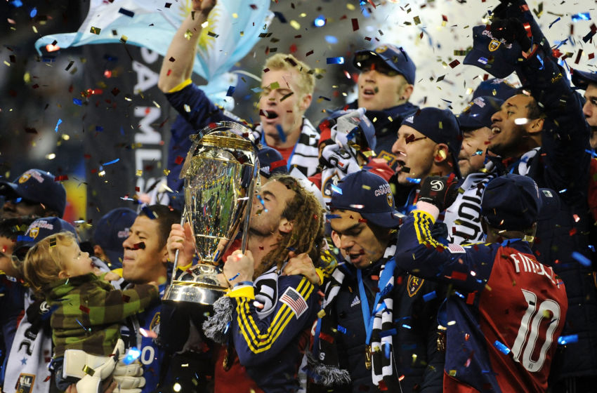 SEATTLE - NOVEMBER 22: Kyle Beckerman #5 of Real Salt Lake kisses the The Philip F. Anschutz MLS Cup trophy as he and his teammates celebrate their win over the Los Angeles Galaxy in the MLS Cup final at Qwest Field on November 22, 2009 in Seattle, Washington. Real Salt Lake won 5-4 in a penalty shootout following regulation time. (Photo by Harry How/Getty Images)