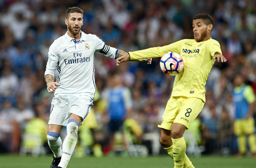 MADRID, SPAIN - SEPTEMBER 21: Sergio Ramos of Real Madrid competes for the ball with Jonathan Dos Santos (R) of Villarreal during the La Liga match between Real Madrid CF and Villarreal CF at Estadio Santiago Bernabeu on September 21, 2016 in Madrid, Spain. (Photo by fotopress/Getty Images)