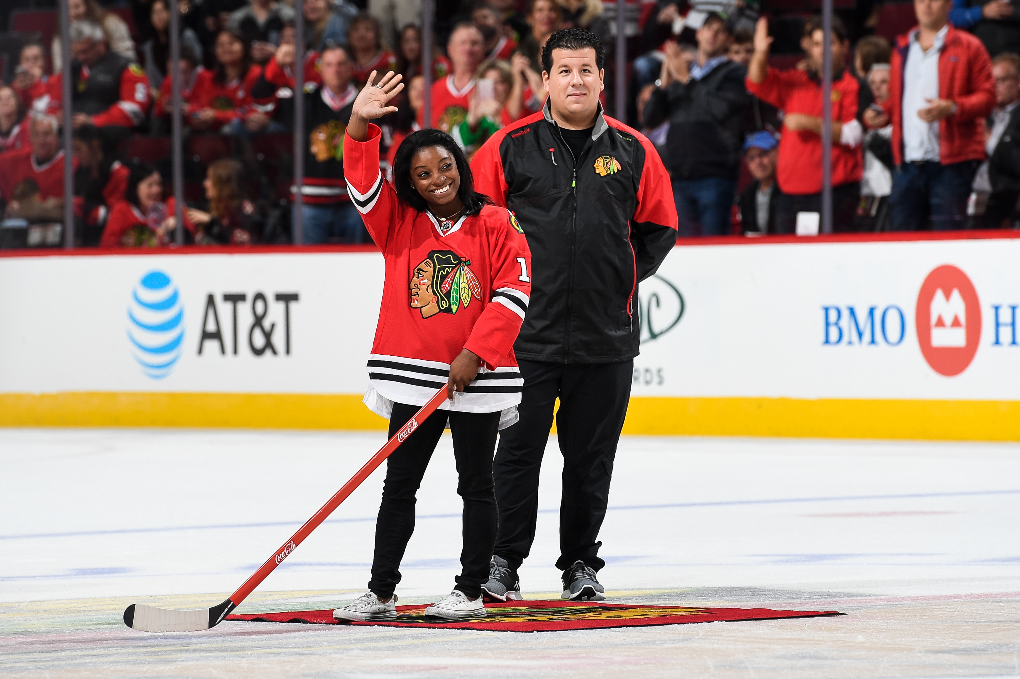 Simone Biles shoots puck at Chicago Blackhawks game