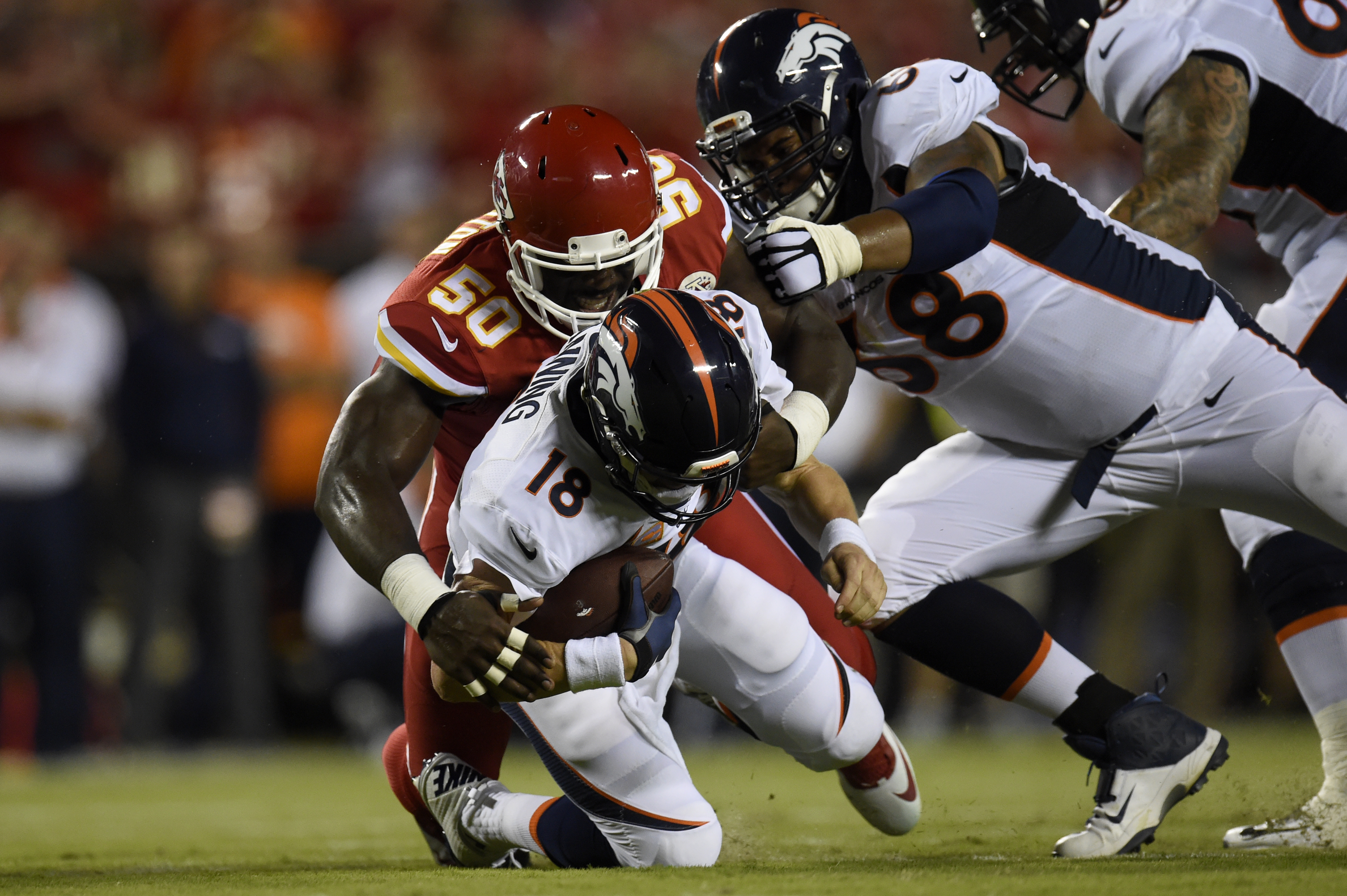 KANSAS CITY, MO - SEPTEMBER 17: Outside linebacker Justin Houston (50) of the Kansas City Chiefs sacks quarterback Peyton Manning (18) of the Denver Broncos as Ryan Harris (68) blocks during the first half of play at Arrowhead Stadium. The Kansas City Chiefs hosted the Denver Broncos on Thursday, September 17, 2015. (Photo by AAron Ontiveroz/The Denver Post via Getty Images)