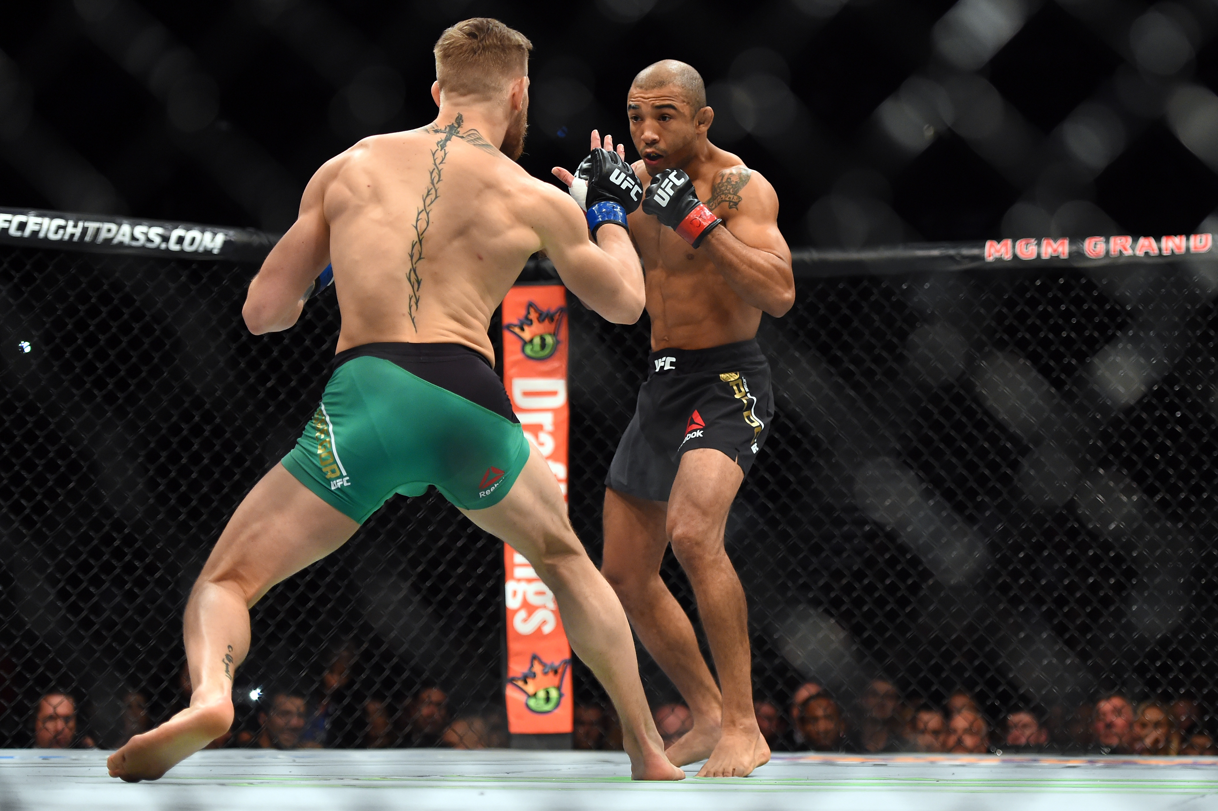 LAS VEGAS, NEVADA - DECEMBER 12: (L-R) Conor McGregor of Ireland faces Jose Aldo of Brazil in their featherweight championship bout during the UFC 194 event inside MGM Grand Garden Arena on December 12, 2015 in Las Vegas, Nevada. (Photo by Jeff Bottari/Zuffa LLC/Zuffa LLC via Getty Images)