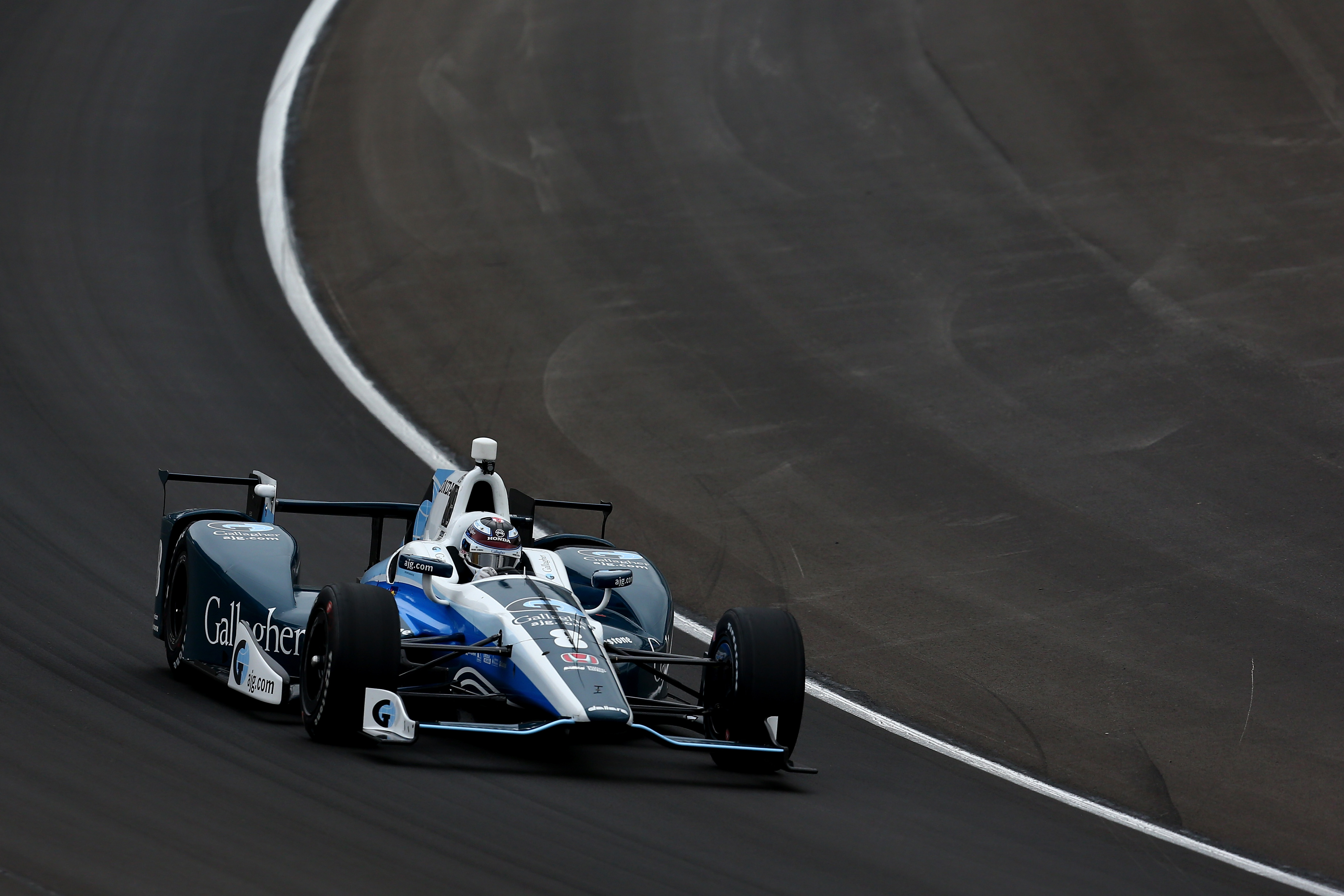 Castroneves ends victory drought, climbs fence at Iowa Castroneves ends victory drought, climbs fence at Iowa