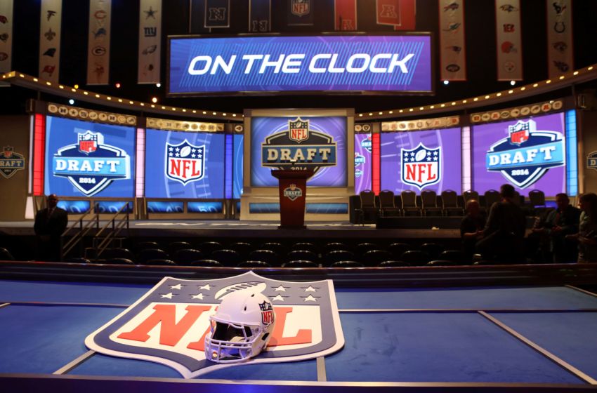 May 8, 2014; New York, NY, USA; A general view of a helmet, NFL shield, stage, and podium before the start of the 2014 NFL Draft at Radio City Music Hall. Mandatory Credit: Adam Hunger-USA TODAY Sports