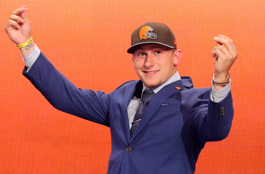 May 8, 2014; New York, NY, USA; Johnny Manziel (Texas A&M) gestures as he walks across the stage after being selected as the number twenty-two overall pick in the first round of the 2014 NFL Draft to the Cleveland Browns at Radio City Music Hall. Mandatory Credit: Brad Penner-USA TODAY Sports